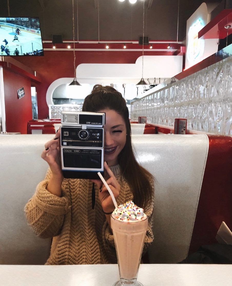 Girl Retro Camera In Restaurant Jukeboxburgers